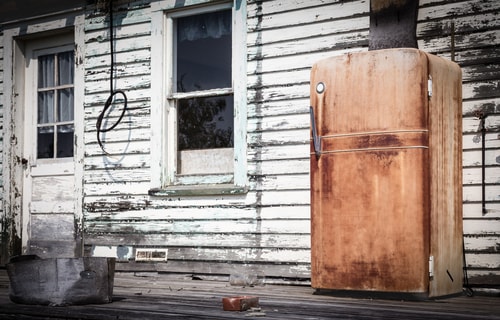 An old, unused fridge ready for appliance removal