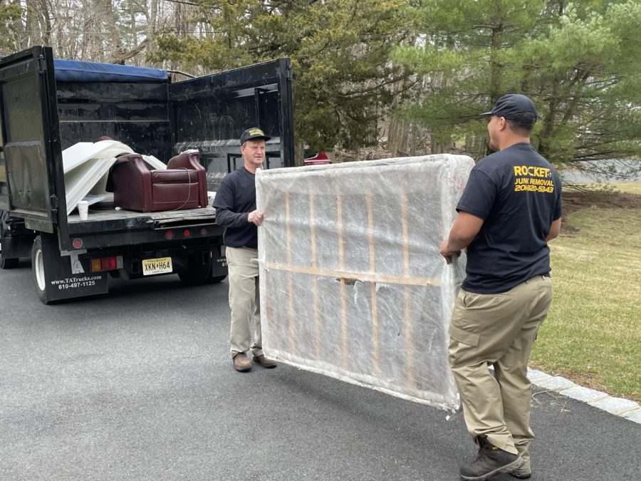 rocket junk hauling mattress to truck