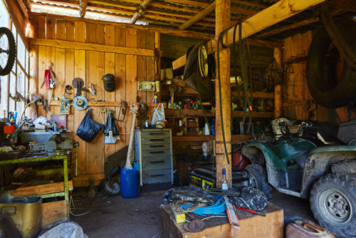 garage filled with junk in need of rocket junk remov