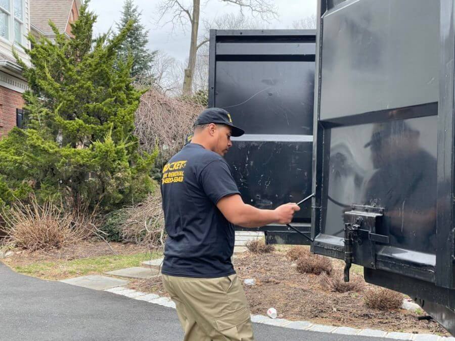 Rocket Junk Removal expert closing truck doors