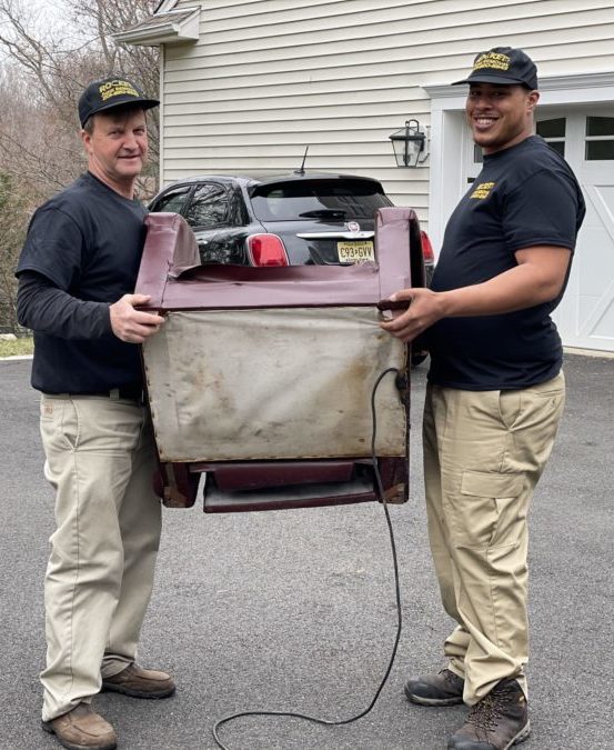 rocket junk removal pros carrying chair