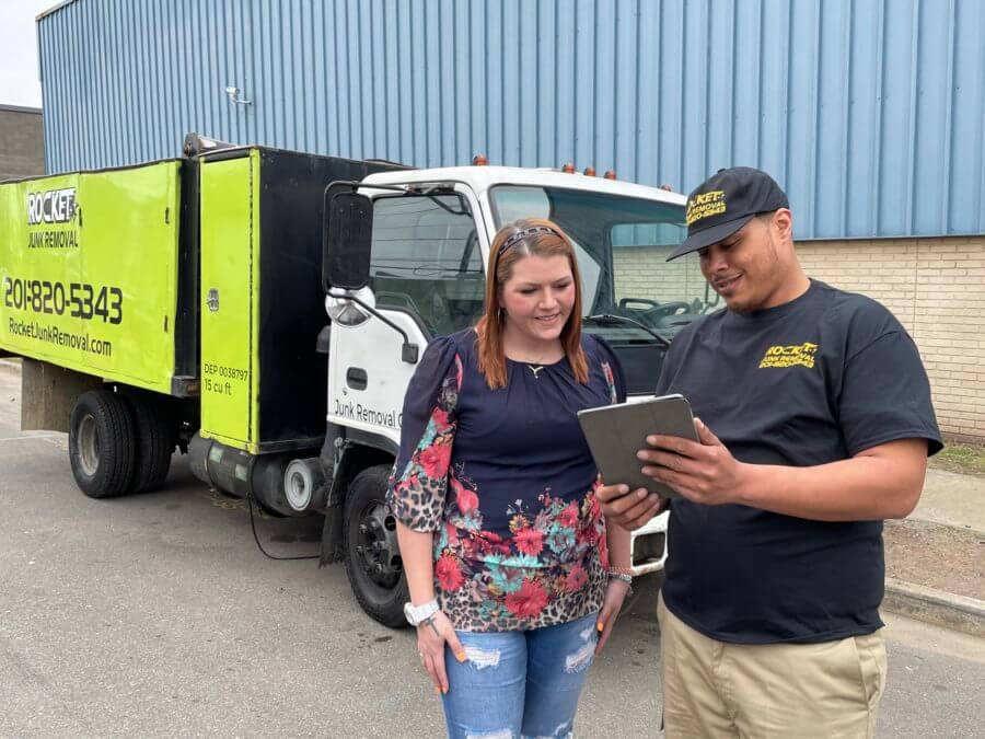 people-smiling-while-discussing-a-quote-for-junk-removal